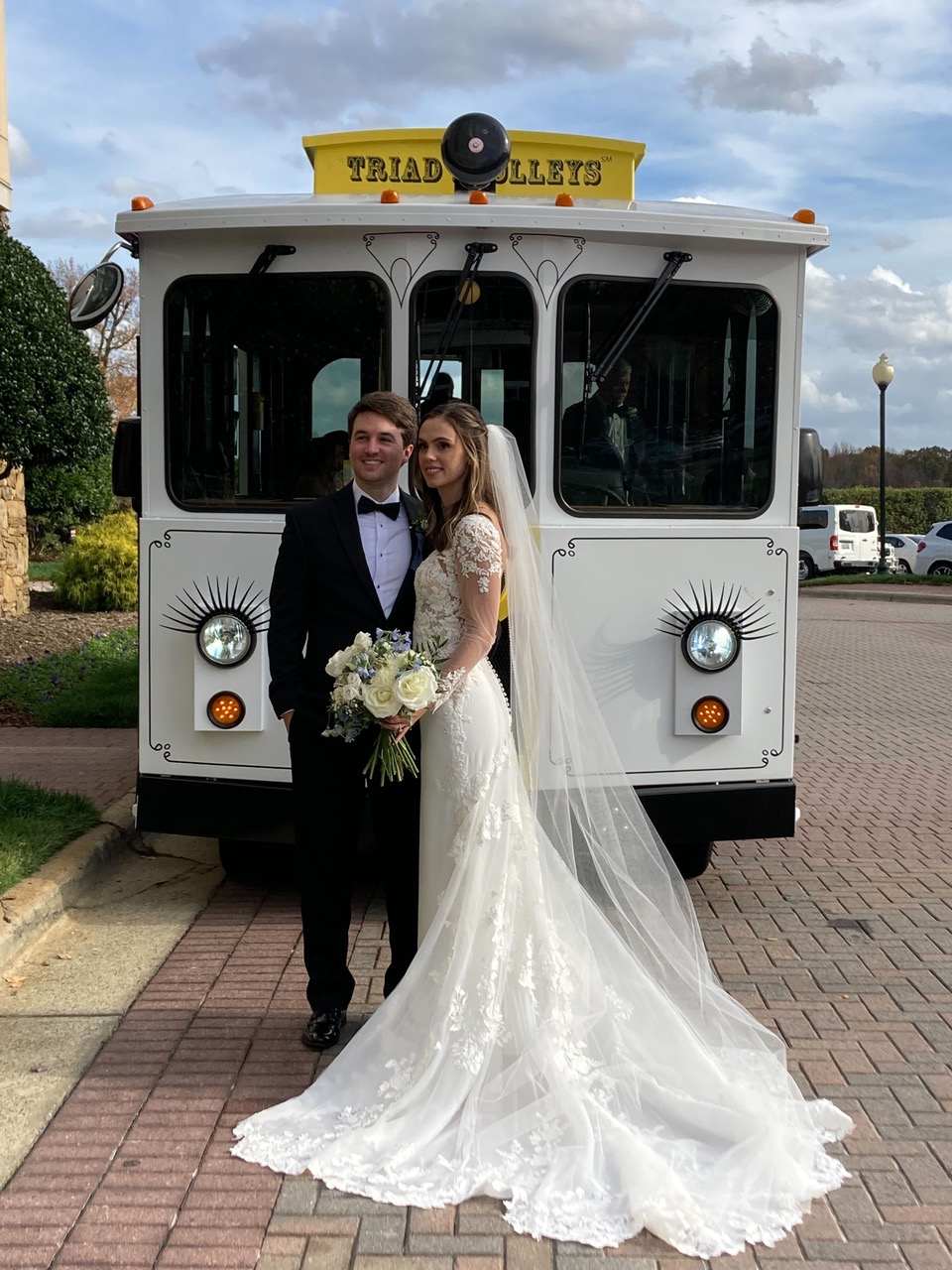 Trolley behind bridal and groom